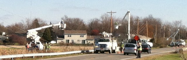 Photo of crews replacing utility poles